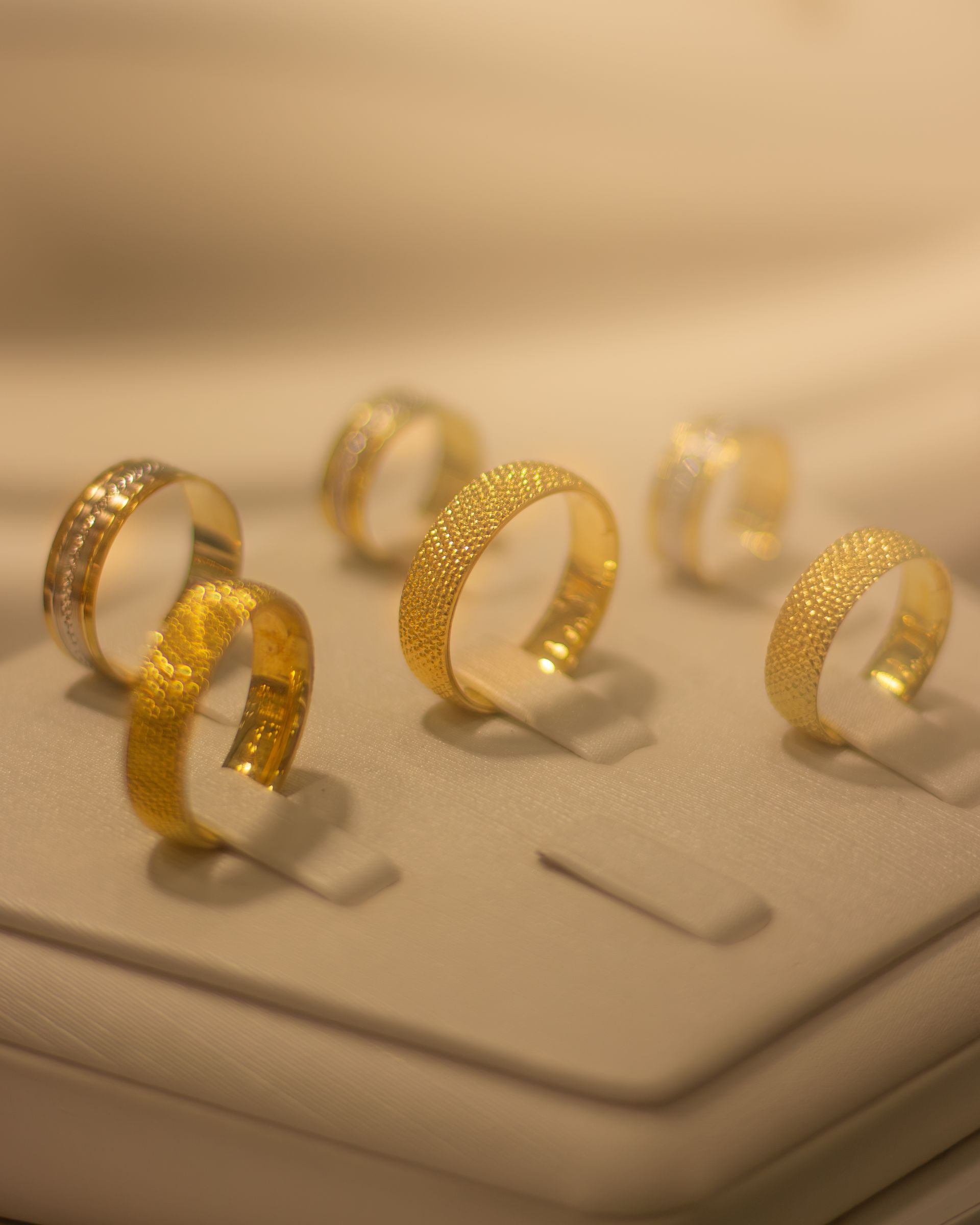 A close-up of finely crafted gold jewellery